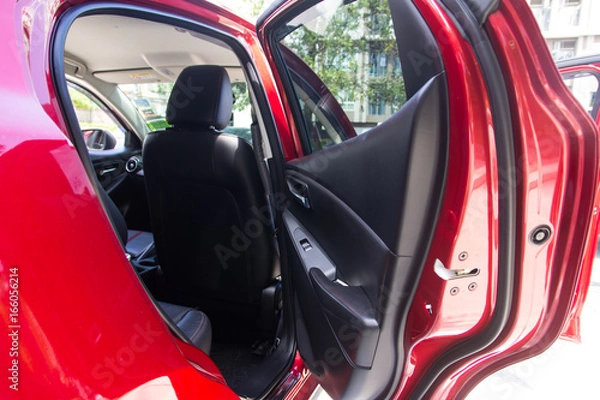 Fototapeta Red vehicle with  open door