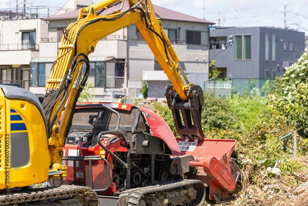 Fototapeta 油圧ショベルと草刈り重機