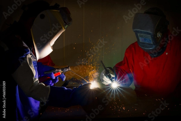 Fototapeta Welding worker at factory,industrial worker.