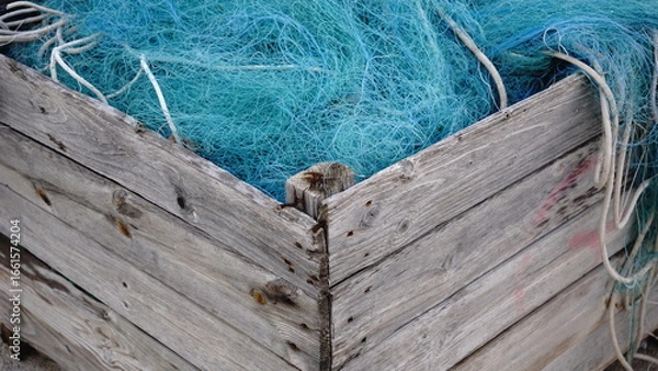 Fototapeta fishing net stored in wooden box