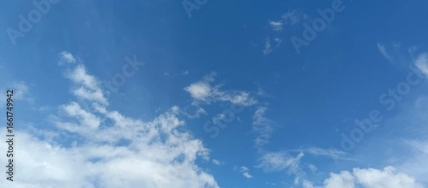 Obraz Clear Blue Sky with White Clouds Background