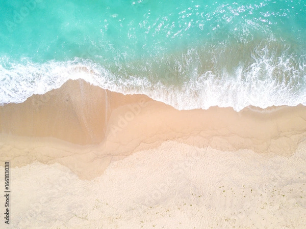 Fototapeta Aerial view of sandy beach and ocean with waves