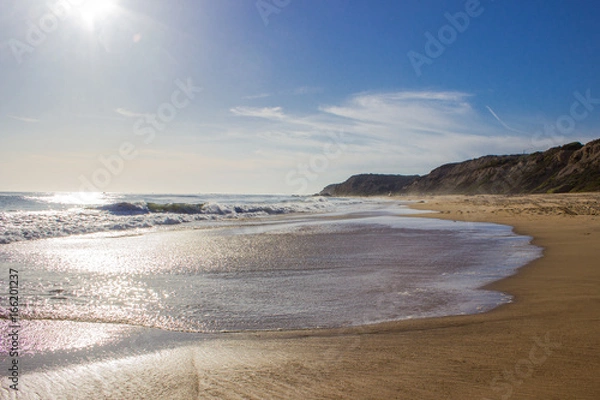 Fototapeta Beautiful beach at the ocean with big cliffs insummer