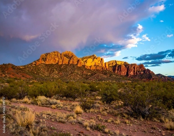 Fototapeta Sunset over desert mountains