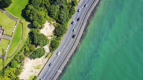 Obraz Aerial view on a road running along sea shore. Auckland, New Zealand.