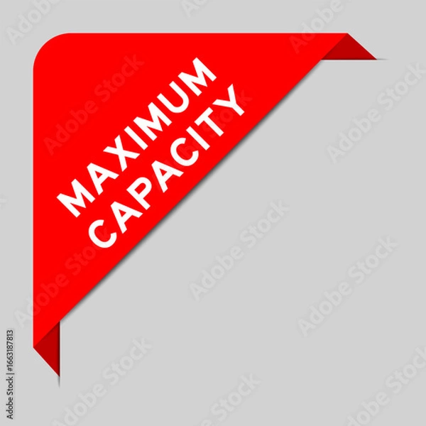 Fototapeta Red color of corner label banner with word maximum capacity on gray background