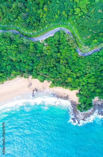 Fototapeta Sea aerial view,Top view,amazing nature background.The color of the water and beautifully bright.Azure beach with rocky mountains and clear water of Thailand ocean at sunny day.Winding road.