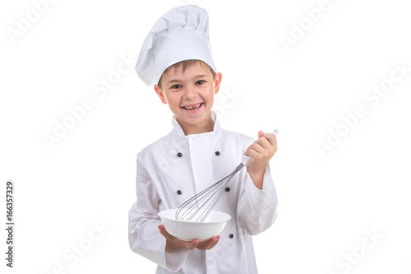 Obraz Happy little chef mixing something with a whisk, on white background.