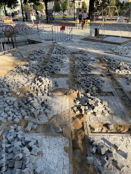 Fototapeta New cobblestone sidewalk being built