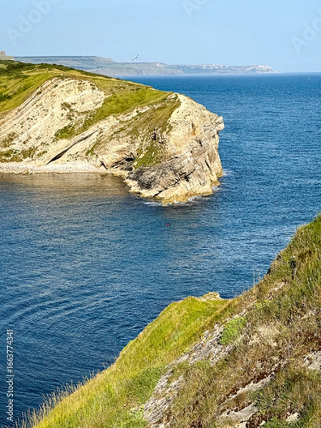 Obraz Lulworth Cove bay, beach and cliffs view . The Jurassic Coast is a World Heritage Site on the English Channel coast of southern England. Dorset, UK. crowded beach, public beach.