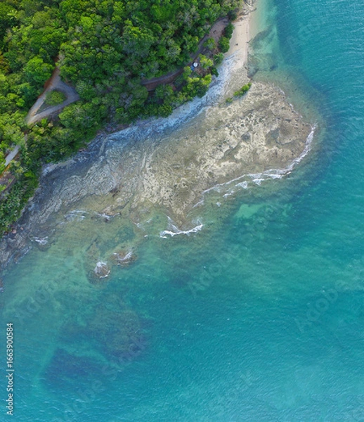 Fototapeta Large reef on the coast of the island, Coast as a background from top view. Turquoise water background from top view
