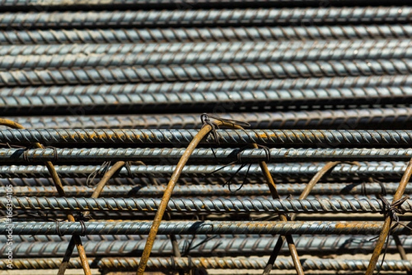 Fototapeta rebar steel bars, reinforcement concrete bars with wire rod used in foundation of construction site