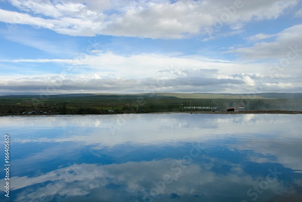 Fototapeta Still Lake Reflecting Clouds in Iceland