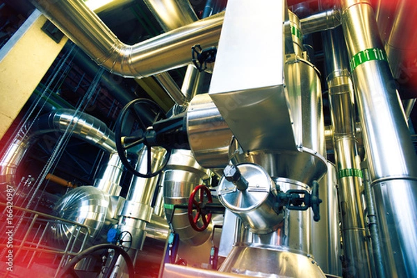 Fototapeta Equipment, cables and piping as found inside of a modern industrial power plant