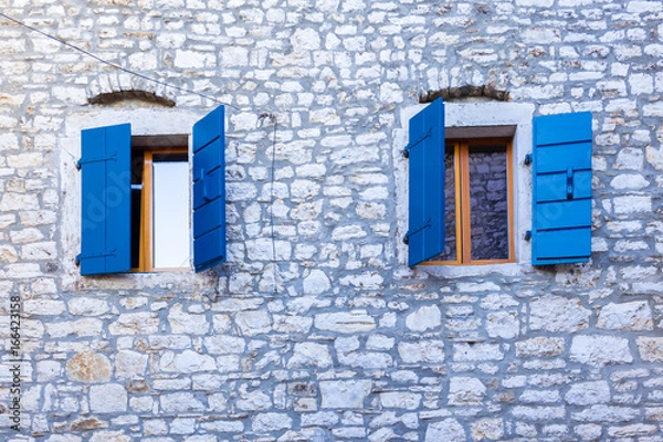 Fototapeta blue windows old house