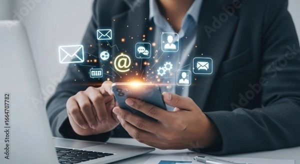 Fototapeta Person using smartphone with digital communication icons floating around, representing online connectivity and messaging