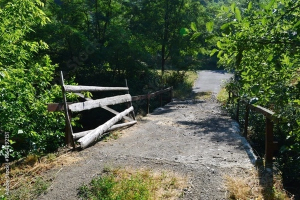 Fototapeta an old bridge with a wooden fence