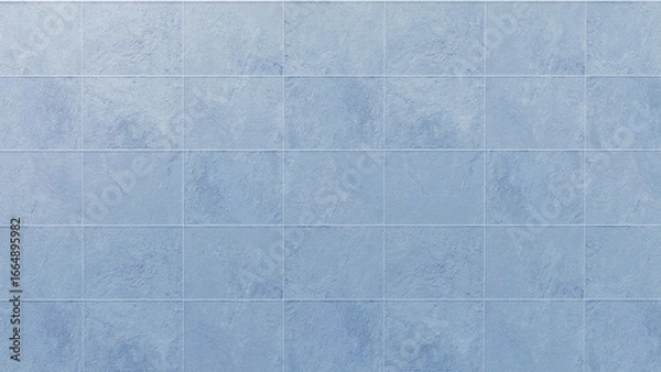 Fototapeta Cool-toned light blue ceramic tile backdrop featuring a gentle, uneven surface finish and rectangular grid layout, offering a versatile aesthetic