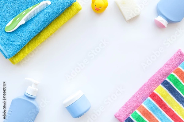 Fototapeta Personal care. Towels, soap and shampoo, cream on white backgrond top view copyspace