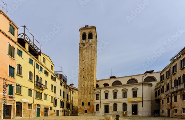 Fototapeta Tall historic bell tower standing in Venetian square