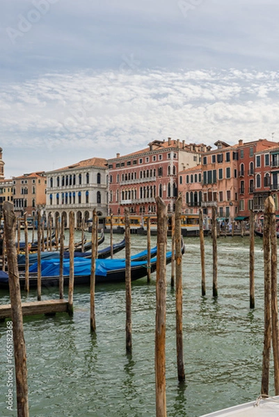 Fototapeta Gondolas moored along the Grand Canal with Venetian facades