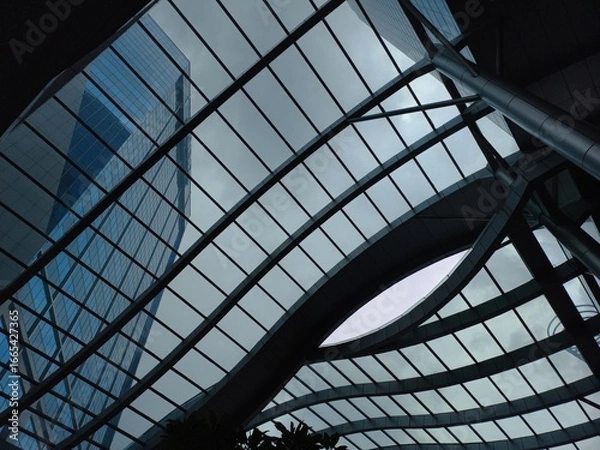 Fototapeta The building roof design uses clear glass, providing maximum natural lighting and saving energy.