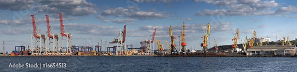 Fototapeta Panorama view on the port with loading cargo ship
