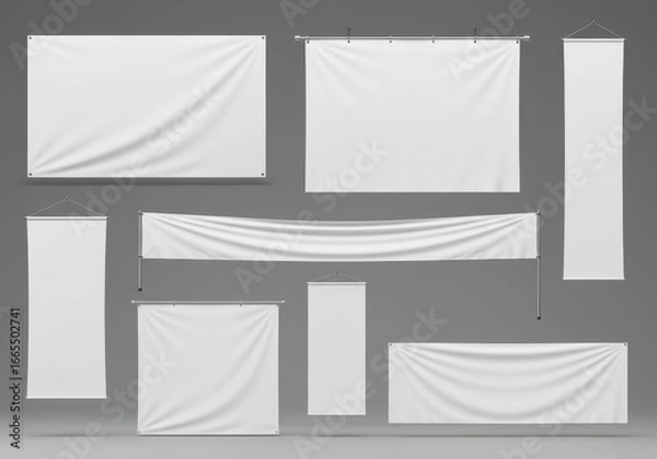 Fototapeta Collection of various blank white advertising banners and signage hanging on poles and ropes against a plain background