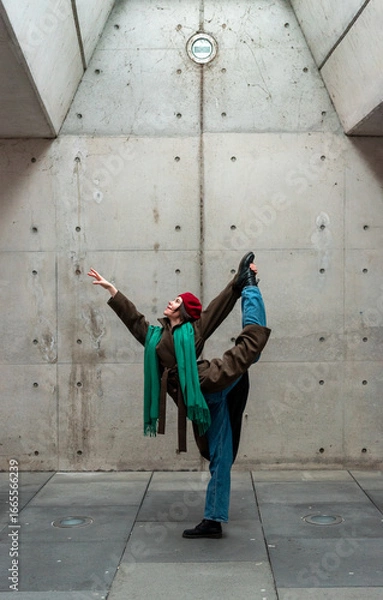 Fototapeta Beautiful ballerina dancing in a tunnel in Stuttgart city