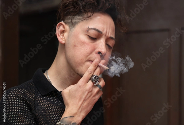 Obraz young man smoking a cigar