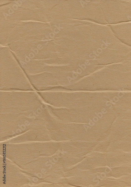 Obraz Brown paper texture with creased folds. Detailed paper texture showing creasing and folds for background or packaging design. Natural material.