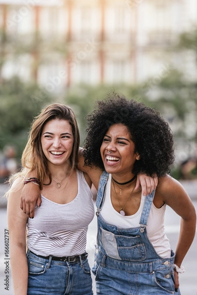 Obraz Beautiful women having fun in the street.