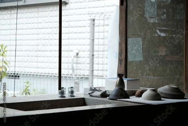 Fototapeta indoor view with ceramic tableware by the sink