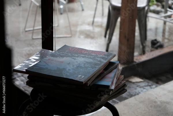 Fototapeta indoor view with a pile of magazines in a wooden frame structure