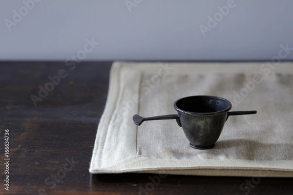 Fototapeta Candle snuffer on table