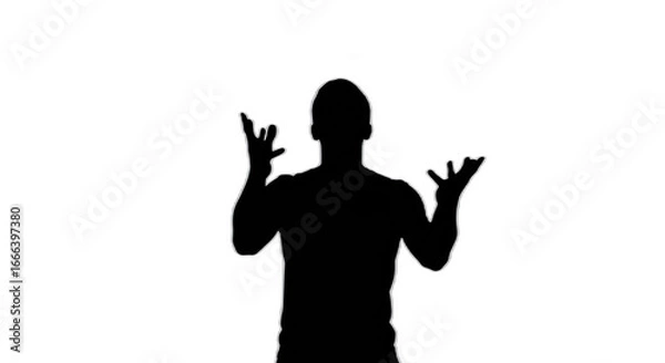Fototapeta Silhouette of a person with hands raised in a gesturing pose against a black background