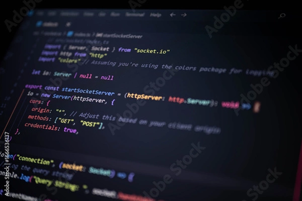 Obraz Close-up of a modern JavaScript code editor screen showing real-time server setup using Socket.IO and HTTP server integration for backend web development.