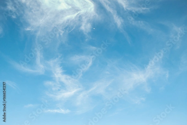 Fototapeta the sky is clear blue with fluffy white clouds, the sky is very bright, and the sun shines.