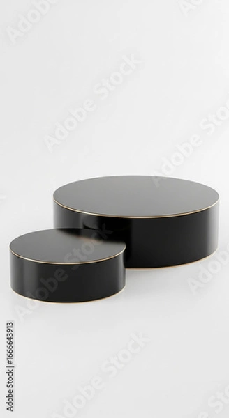 Fototapeta Two black cylindrical platforms with gold trim, on white background, ideal product display or mockup for advertising, showcasing elegance and minimalism