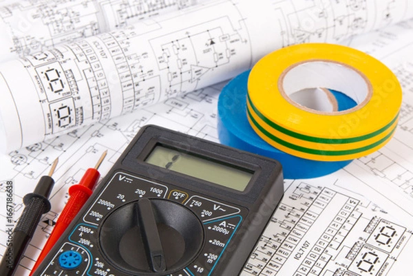 Obraz electrical engineering drawings, insulating tape and digital multimeter