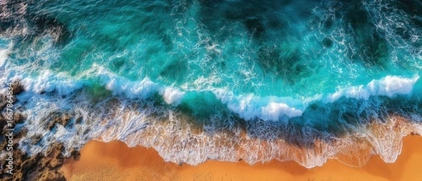 Fototapeta Aerial view of turquoise waves crashing on a sandy beach (4)