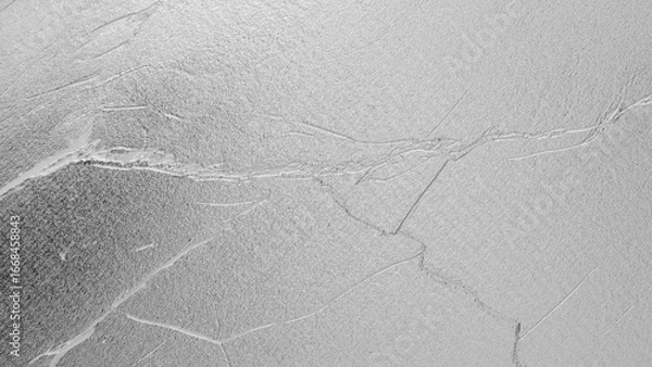 Fototapeta White plaster wall texture with subtle cracks and rough surface, minimal elegant background for design, architecture, and decoration.