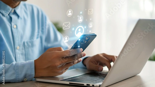 Fototapeta Stay connected with seamless communication and innovative social media solutions on your phone and laptop, making work life easier with technology