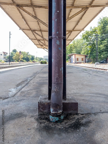 Fototapeta Rain Gutter on Column of Train Station Platform.