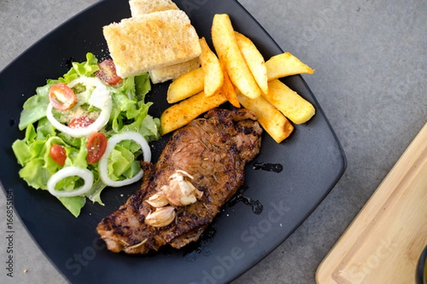 Obraz Meat Steak with salad and French Fries and sauce