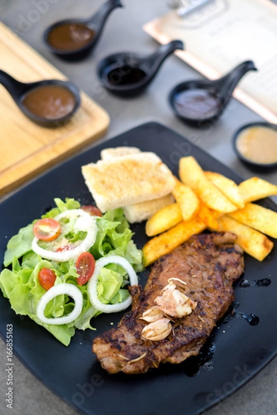 Obraz Meat Steak with salad and French Fries and sauce