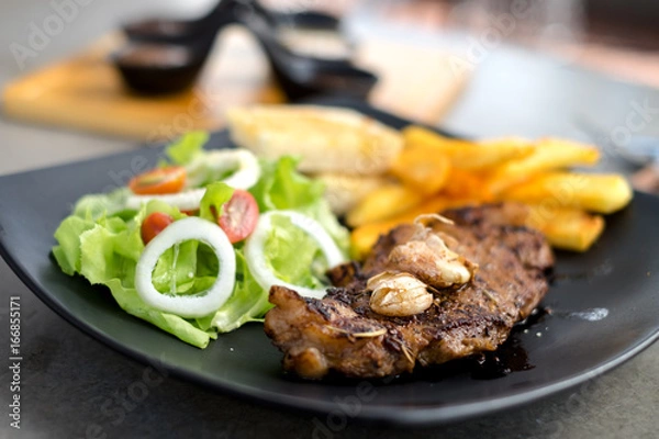 Obraz Meat Steak with salad and French Fries and sauce