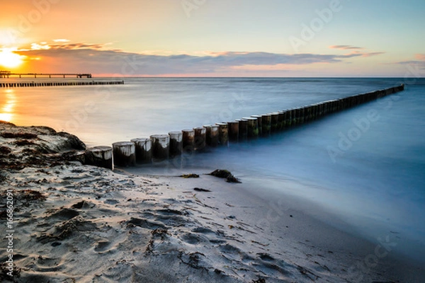 Obraz Zachodzące słońce na plaży w Heiligenhafen