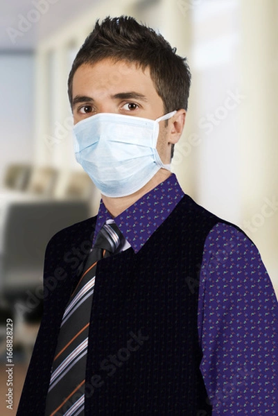 Fototapeta A young professional in formal attire wearing a medical mask, symbolizing health and safety precautions in a workplace environment.