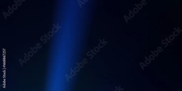 Fototapeta Abstract background featuring deep blues and a central vertical beam of bright light ray.